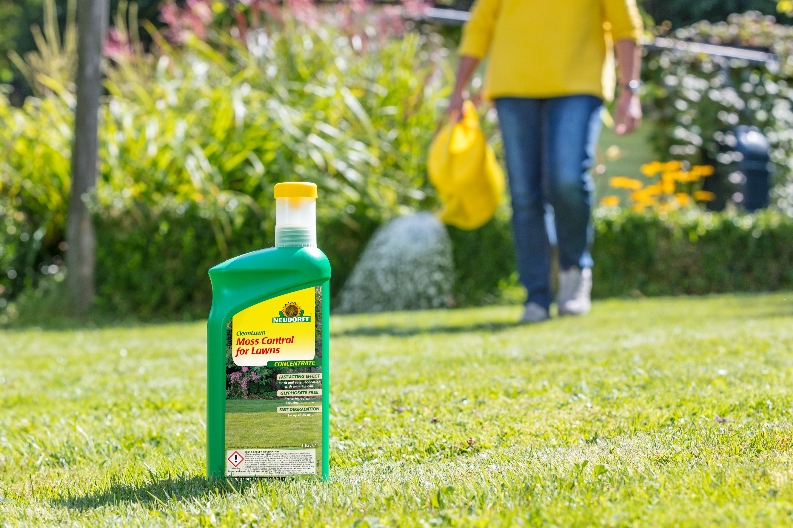 Fight moss in the lawn without harming grass or staining surrounding stone areas.